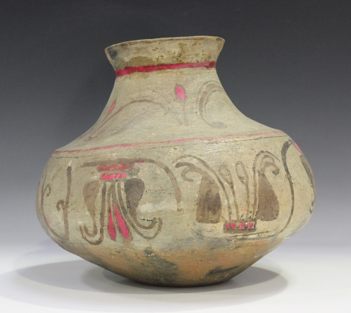 A pre-Columbian pottery pot, probably Mexican, 200 BC/200 AD, of bulbous shape with tapered neck and