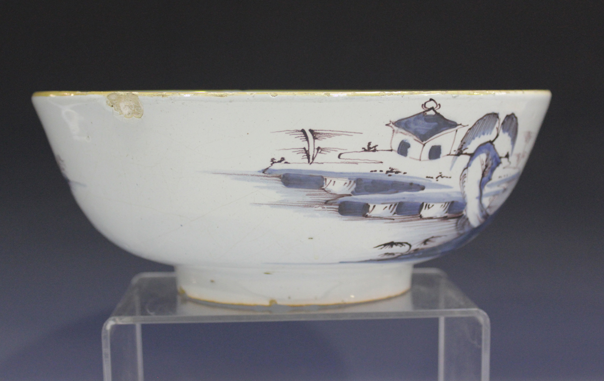 An English Delft circular bowl, London or Bristol, circa 1760, the exterior painted in manganese and - Image 11 of 14