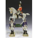 A large Sitzendorf equestrian military figure, titled 'The Scots Greys 1815', 20th century, black