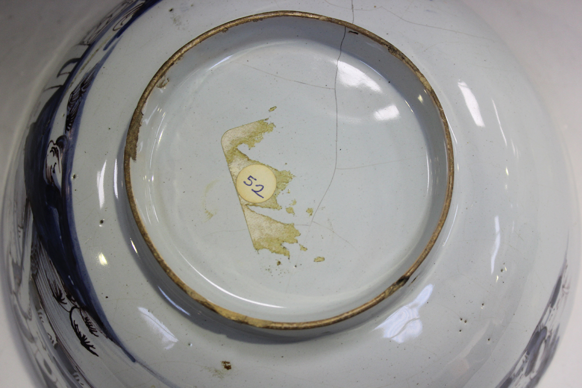 An English Delft circular bowl, London or Bristol, circa 1760, the exterior painted in manganese and - Image 9 of 14