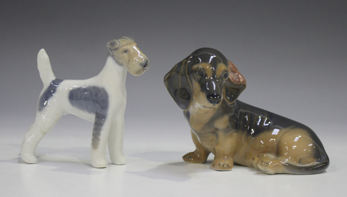 Two Royal Copenhagen dogs, comprising Dachshund, No. 3140, and Wire-haired Terrier, No. 3170.Buyer’s