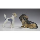 Two Royal Copenhagen dogs, comprising Dachshund, No. 3140, and Wire-haired Terrier, No. 3170.Buyer’s