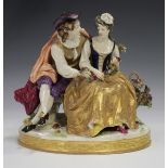 A Continental porcelain figure group, 20th century, modelled as a seated courting couple in 18th