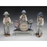 Three Lladro porcelain figures, comprising Jazz Drums, No. 5929, Jazz Horn, No. 5832, and Jazz