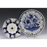 A Dutch Delft blue painted charger, 18th century, with floral decoration within a geometric and