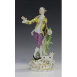 A Meissen figure of a gentleman, 20th century, modelled leaning on a tree stump, a lamb at his feet,