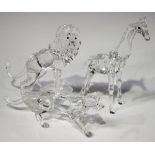 A Swarovski Crystal lion, designed by Martin Zendron, modelled standing on a rock, height 11.7cm (