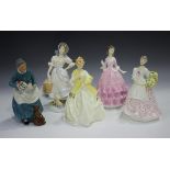 A Royal Doulton figure The Favourite, HN2249, together with four Royal Worcester figures, comprising
