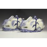 A pair of Italian pottery tureens and covers in the form of rabbits, 20th century, both crouching,