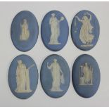 Six Wedgwood pale blue jasperware oval plaques, 19th century, each sprigged in white with a