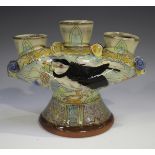 A Maureen Minchin studio pottery candlestick with three candle apertures, the front decorated with a