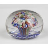 A Baccarat glass close packed millefiori mushroom paperweight, circa 1850, the central tuft above