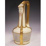 An Art Nouveau Austrian porcelain jug, early 20th century, the cream glazed squat body decorated