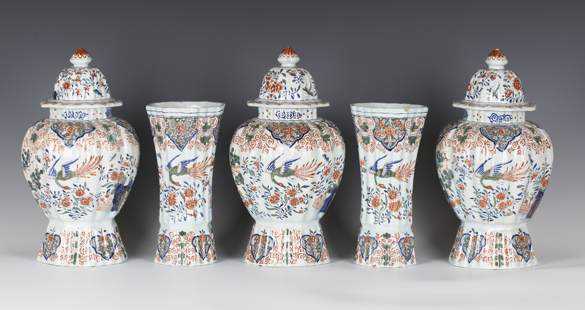 A garniture of five Dutch Delft vases and three covers, late 19th century, comprising two of