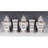 A garniture of five Dutch Delft vases and three covers, late 19th century, comprising two of