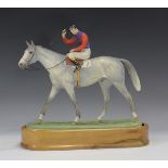 A Royal Worcester bone china equestrian model 'The Winner', by Doris Lindner, black printed marks