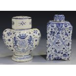 An unusual Dutch Delft tea caddy and cover, 19th century, of shouldered rectangular form, painted to