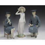 Three Lladro figures, comprising Boy Graduate, No. 5198, Girl Graduate, No. 5199, and Breezy