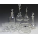 A silver mounted cut glass circular bowl, diameter 20cm, together with four cut glass decanters