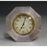 A George V silver octagonal cased bedside timepiece, the dial with Arabic numerals and detailed '8-