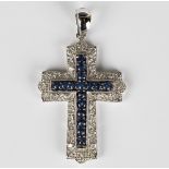 A 9ct white gold, sapphire and diamond pendant, designed as a cross, mounted with a row of