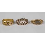 A Victorian 15ct gold, ruby and diamond set three stone ring in a buckle and strap design,