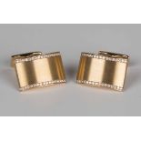 A pair of gold and diamond dress cufflinks, each curved rectangular front mounted with a row of