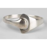 A Georg Jensen Hans Hansen silver sprung bangle of abstract design, detailed 'Georg Jensen Hans