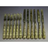 A set of six early Victorian silver gilt Queen's pattern fruit knives and forks, Sheffield 1839 by