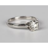 A platinum and diamond single stone ring, claw set with a circular cut diamond, detailed 'Plat',