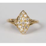 An Edwardian 18ct gold and diamond marquise shaped cluster ring, mounted with cushion cut diamonds