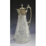 A Victorian plated cut glass claret jug, the flared body engraved with spiralling bands of