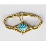 A Victorian gilt metal and turquoise coloured paste bracelet, the front in an oval domed design,