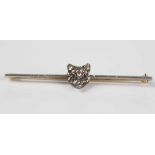 A bar brooch with a rose cut diamond set fox's mask mounted to the centre, width 5.2cm, with a