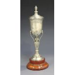 A George VI silver diminutive trophy cup and cover with urn finial, the body engraved with a foliate