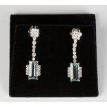 A pair of white gold, aquamarine and diamond pendant earrings, each drop claw set with a rectangular