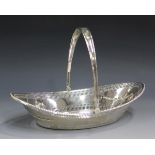 A late Victorian silver oval boat-shaped bread basket with swing handle, the pierced body with