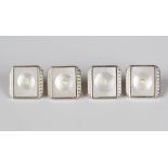 Four gold, mother-of-pearl and half-pearl set buttons, detailed '18ct 9ct', total weight 4g (two