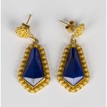 A pair of gold and lapis lazuli pendant earrings, each mounted with a faceted kite shaped lapis