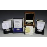 A Jubilee Mint 22ct gold proof Tristan da Cunha half-laurel, weight 4g, a Jubilee Mint platinum