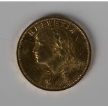 A Switzerland gold twenty francs 1935.Buyer’s Premium 29.4% (including VAT @ 20%) of the hammer