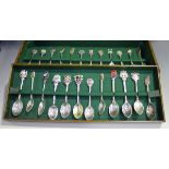 A group of forty-one Elizabeth II silver souvenir spoons, the majority with enamelled terminals,