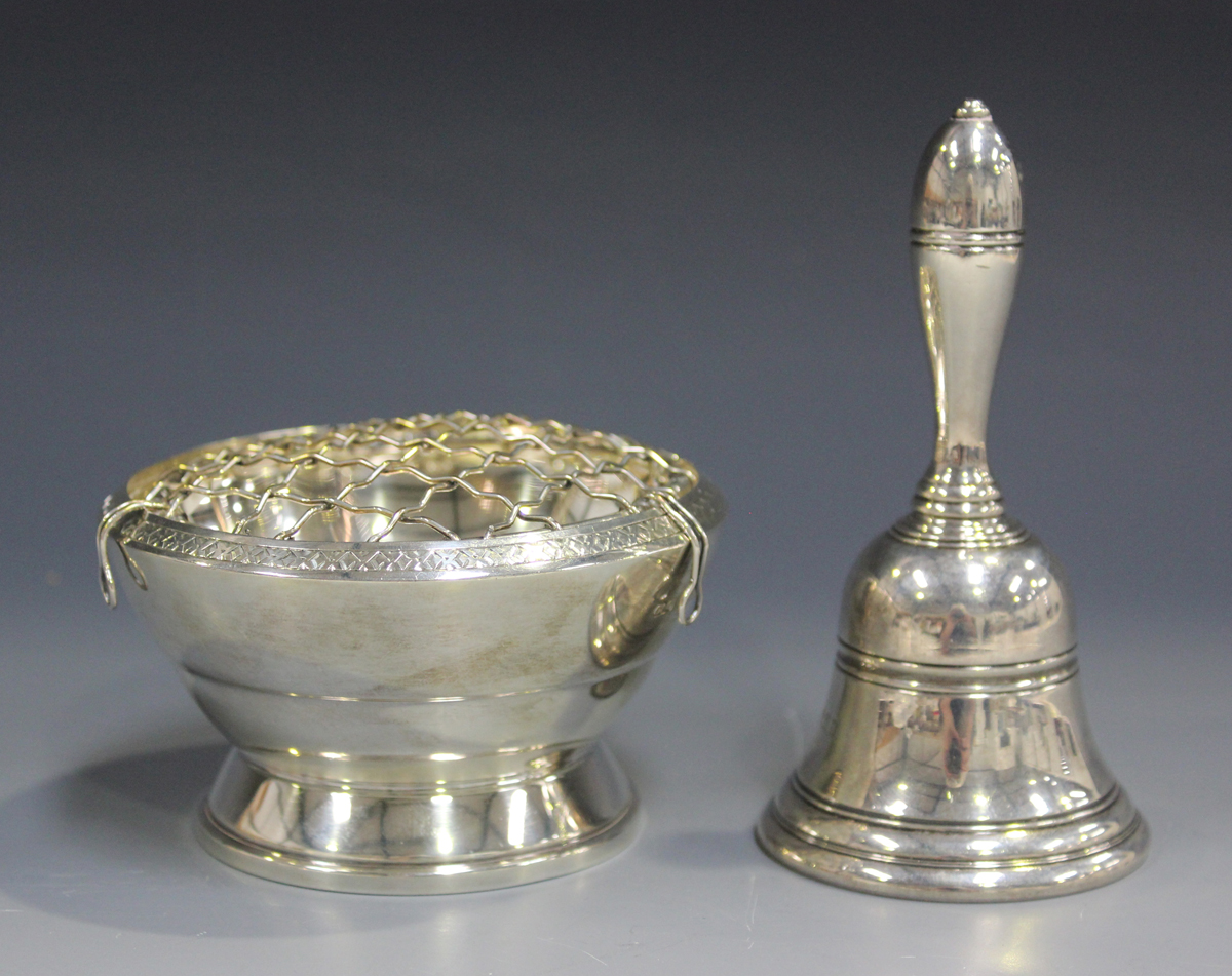 An Elizabeth II silver bell with turned handle, Birmingham 1969, height 11.1cm, together with a