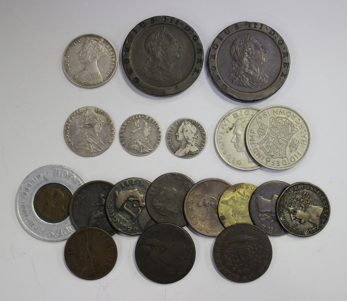 A group of British coinage and tokens, including a George II sixpence 1757, a George III shilling