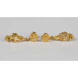 A pair of 22ct gold pendant earrings, each pierced basket drop supported by a bar with pierced