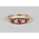 An 18ct gold, ruby, synthetic ruby and diamond five stone ring, weight 2.6g, ring size approx Q.