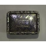 A William IV silver rectangular vinaigrette, the hinged lid engraved with geometric decoration