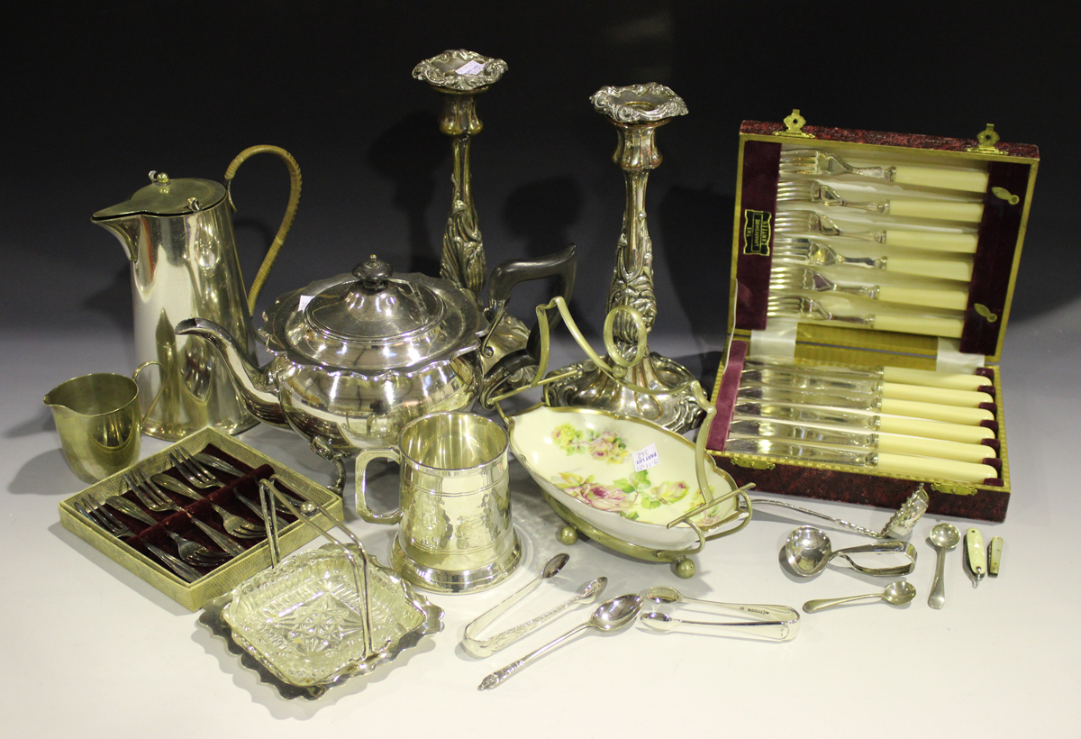 A collection of plated items, including a pair of candlesticks, two teapots and a tankard.Buyer’s - Image 2 of 2