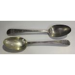 A pair of George III silver Old English pattern table spoons with bright cut engraved decoration,