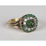 A gold, diamond and green paste cluster ring, the central green paste mounted within a surround of